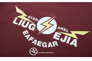 Close-up of graphic lightning print and white typography on burgundy cotton t-shirt