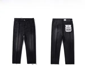 Detail view of men's vintage washed straight jeans showing front and back design