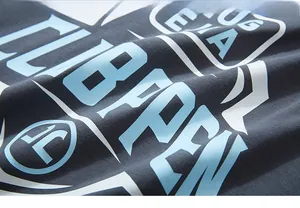 Close-up of streetwear t-shirt fabric with abstract letter prints and detailed texture