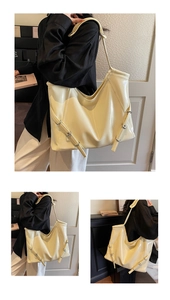 Détail du sac cabas en similicuir crème avec boucle vintage et finition brillante