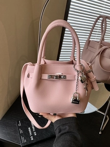 Pink litchi leather mini bucket bag with silver hardware and fashion heart charm