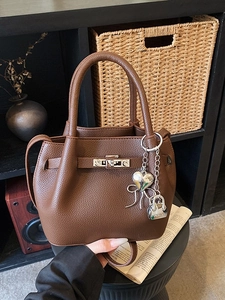 Retro dark brown pebbled leather bucket bag with top handle and silver twist lock