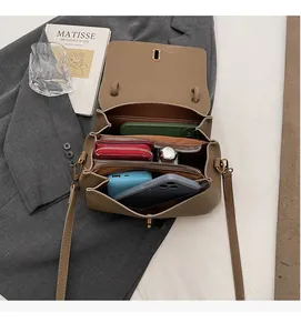 Top view of brown crossbody bag showing spacious interior compartments for essentials