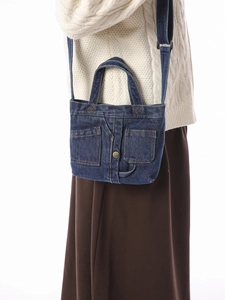 Retro dark blue denim mini crossbody bag with double front utility pockets and adjustable strap