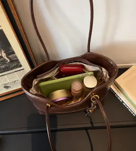 Top view showing the spacious interior of this dark brown leather tote bag for essentials