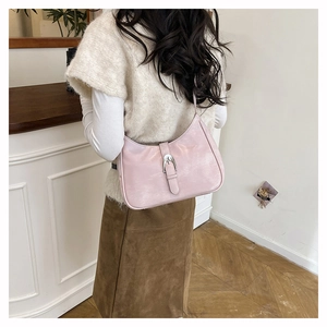 Pale pink pearl finish hobo bag detail showing the silver piston buckle and strap