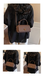 Detailed view of brown lychee leather handbag with knotted handle and gold metal lock