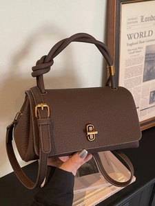 Vintage dark brown lychee texture handbag with unique knotted handle and gold metal lock
