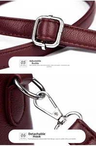 Détails de la boucle argentée et du crochet amovible sur un sac en cuir bordeaux