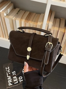 Retro dark brown matte leather handbag with white stitching and metal buckle detail