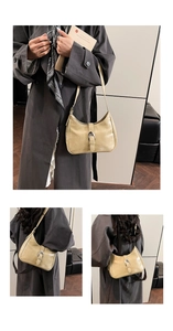 Detail of light beige glossy leather shoulder bag with silver metallic buckle on strap