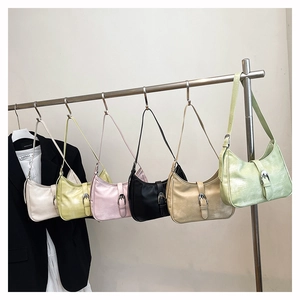 Detailed row of vintage hobo bags in six colors with metallic eyelet buckle decorations