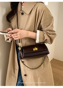 Sophisticated retro dark brown leather crossbody bag with gold chain strap detail