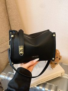 Chic black litchi pattern leather handbag with gold zipper and stylish metal lock