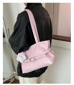 Pink PU leather tote bag with stylish buckle strap and plush cat charm detail