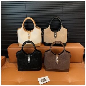 Detail showing four stylish tote bags in khaki, black, and brown with vintage metal buckles