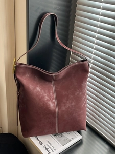 Large dark reddish-brown suede tote bag with white contrast stitching for daily commute