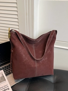 Large dark brown suede tote bag with white contrast stitching and gold metal hardware