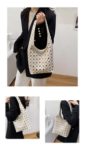 Detail of cream studded tote bag showing silver rivets and soft PU leather texture