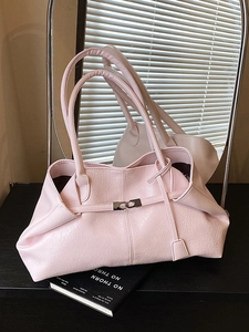 Minimalist light pink tote bag with textured faux leather and metal ring details