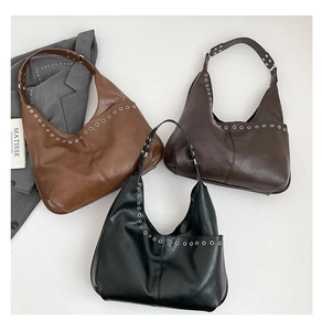 Detailed top view of hobo bags in brown, coffee, and black with metal grommet accents