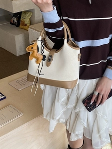 Two-tone tote bag in beige and brown leather with metal twist lock and horse charm