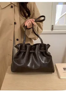 Detailed view of dark brown pleated tote bag with large capacity and soft texture