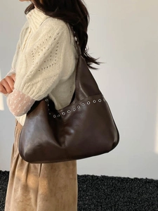 Large dark brown shoulder bucket bag with silver eyelets for women's city commute