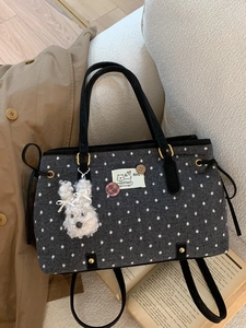Chic dark gray polka dot tote bag with cute plush rabbit charm and gold hardware