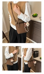 Detail of coffee brown litchi pattern bucket bag with cute bear charm and bow