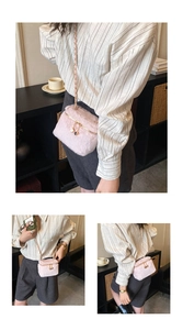 Detail of pink faux fur mini box bag with golden chain strap and soft plush texture