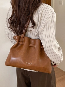 Brown pleated PU leather tote bag with Korean lettering and adjustable tie closure