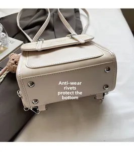 Detail of the bag base featuring four protective metal studs to prevent wear and tear