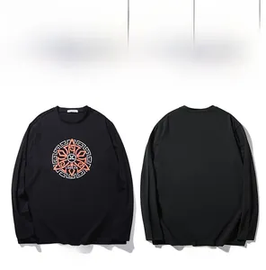 Detail view of oversized black cotton T-shirt with orange graphic print and 10XL size tag
