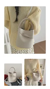 Litchi texture beige bucket bag detail showing versatile shoulder and handheld styling