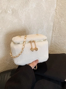 Mini white plush crossbody bag with gold chain strap and luxury boxy design for women