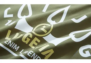 Detail of army green cotton t-shirt with premium white and gold graphic letter prints