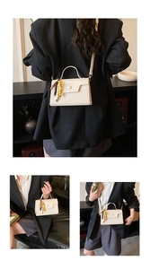 Detail of cream white PU crossbody bag with colorful wooden bead tassel charm detail