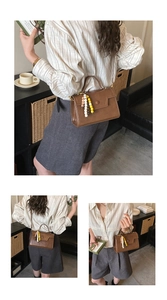 Brown retro crossbody bag featuring minimalist square design and colorful beaded charm