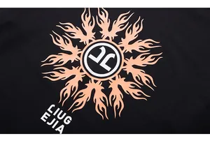 Close-up of orange fire pattern and LIUG EJIA logo print on black cotton long sleeve T-shirt