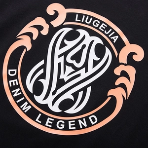 Men's oversized black long sleeve T-shirt with orange tribal print and graphic letters