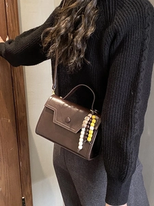 Retro dark brown leather envelope crossbody bag with decorative wooden beads and round clasp