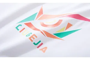 Close-up of geometric multicolor print and lettering on white long-sleeve cotton T-shirt
