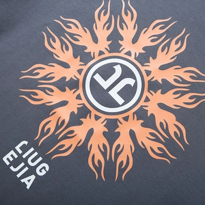 Deep grey oversized long sleeve T-shirt with orange flame mandala and graphic print