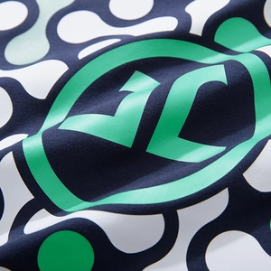 Navy blue oversized T-shirt with green geometric prints and logo on knitted fabric