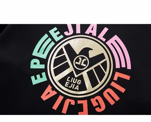 Detailed close-up of the eagle logo and colorful letter printing on a black cotton sweatshirt