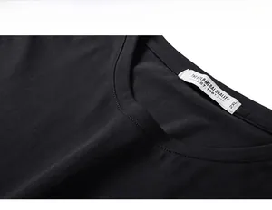 Detail of a black T-shirt crew neck with double stitching and size 2XL woven label