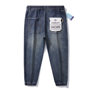 Men's loose fit elastic waist joggers in vintage wash dark blue stretch denim