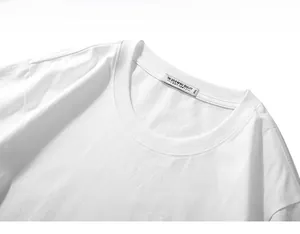 Detail of white cotton crew neck with high-quality jacquard texture and 3XL size label