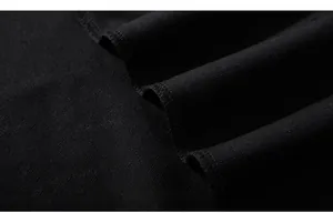 Detailed macro shot of premium black knit fabric texture and high-quality seam stitching